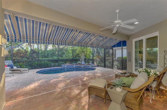 view of swimming pool featuring ceiling fan and a patio