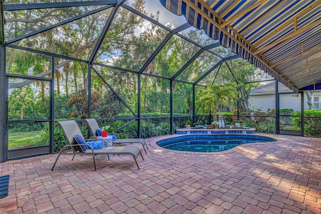 view of pool with a lanai and a patio area