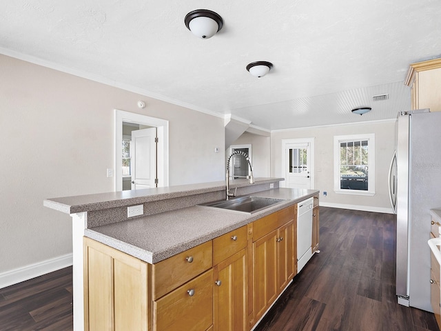 2724 Ashton Rd, Sarasota, FL 34231 - kitchen featuring freestanding refrigerator, white dishwasher, dark wood-style flooring, a center island with sink, and ornamental molding