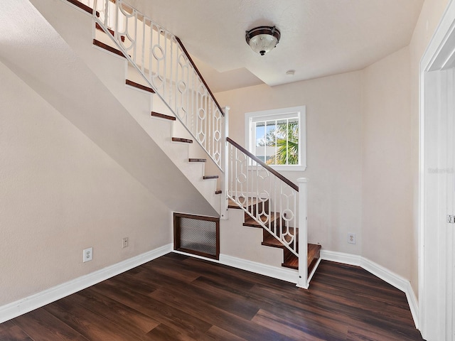 2724 Ashton Rd, Sarasota, FL 34231 - stairs featuring wood finished floors and baseboards