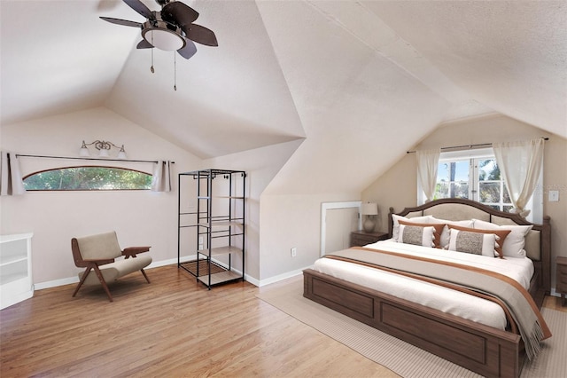 2724 Ashton Rd, Sarasota, FL 34231 - bedroom with vaulted ceiling, wood finished floors, baseboards, and ceiling fan