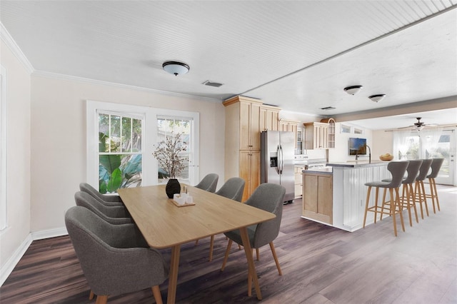 2724 Ashton Rd, Sarasota, FL 34231 - dining room with plenty of natural light, dark wood finished floors, crown molding, baseboards, and ceiling fan
