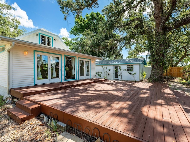 2724 Ashton Rd, Sarasota, FL 34231 - wooden terrace featuring french doors and an outdoor structure