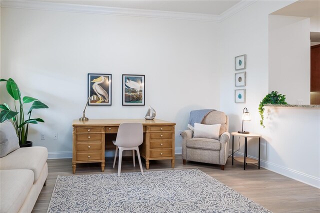 office with hardwood / wood-style floors and crown molding