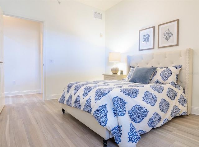 bedroom with light hardwood / wood-style floors