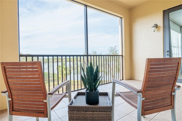 balcony featuring a water view