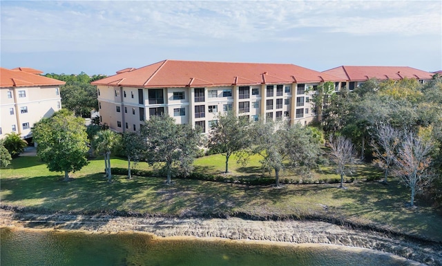 view of building exterior with a water view