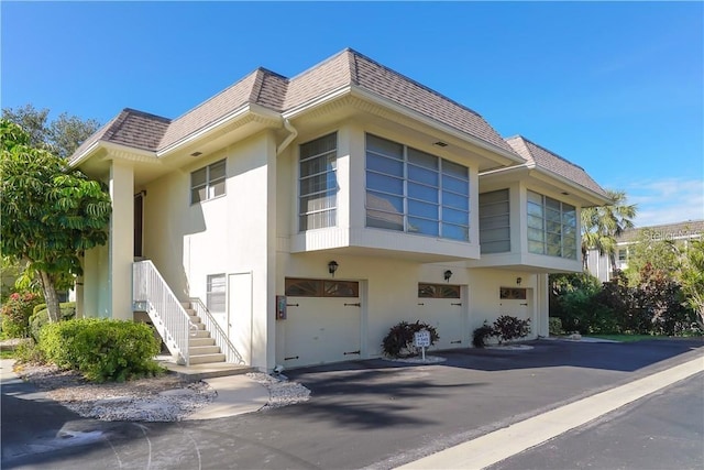 view of side of home featuring a garage