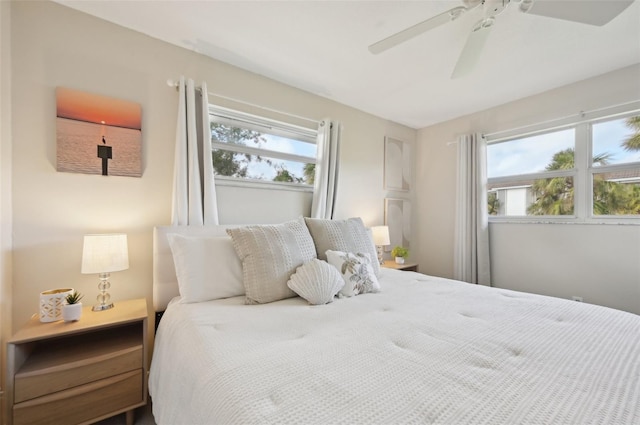 bedroom with multiple windows and ceiling fan