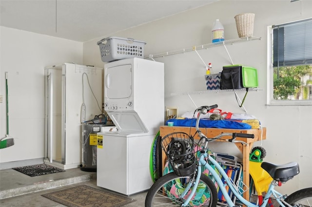 washroom with stacked washer / drying machine