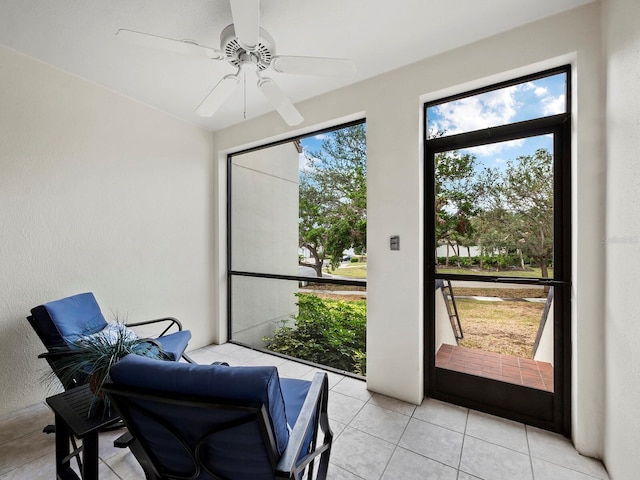 sunroom / solarium with ceiling fan