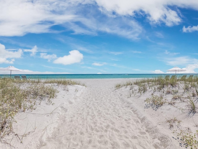 property view of water featuring a beach view