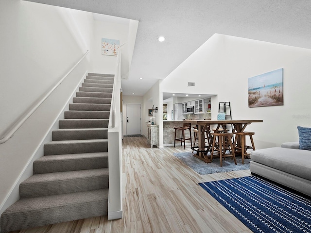 staircase featuring wood-type flooring