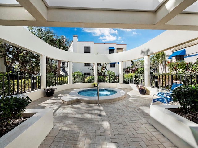 view of pool with a community hot tub and a patio