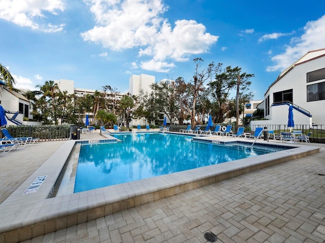 view of swimming pool with a patio area