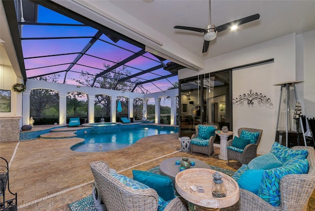 pool at dusk with ceiling fan