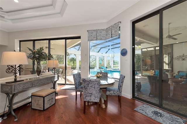 dining area featuring ceiling fan, wood-type flooring, and ornamental molding