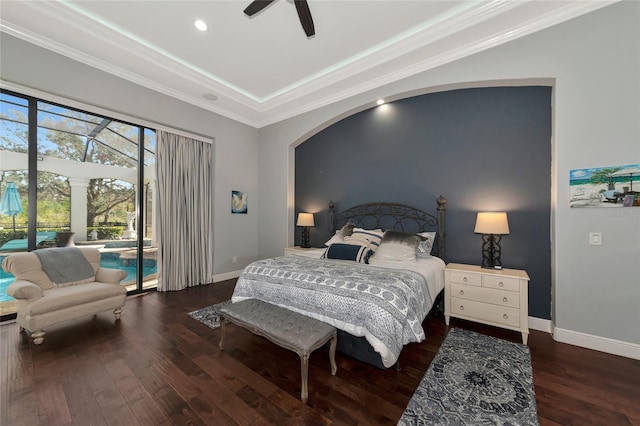 bedroom with crown molding, ceiling fan, dark hardwood / wood-style floors, access to exterior, and a tray ceiling