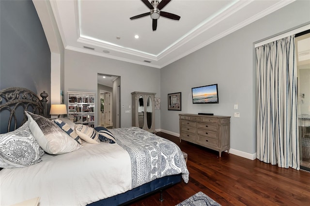 bedroom featuring a raised ceiling, ceiling fan, dark wood-type flooring, and crown molding