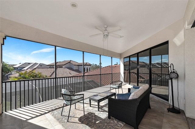 sunroom featuring ceiling fan