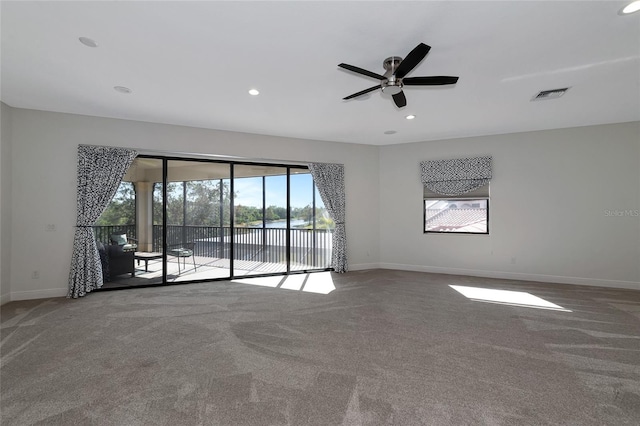 carpeted empty room with ceiling fan