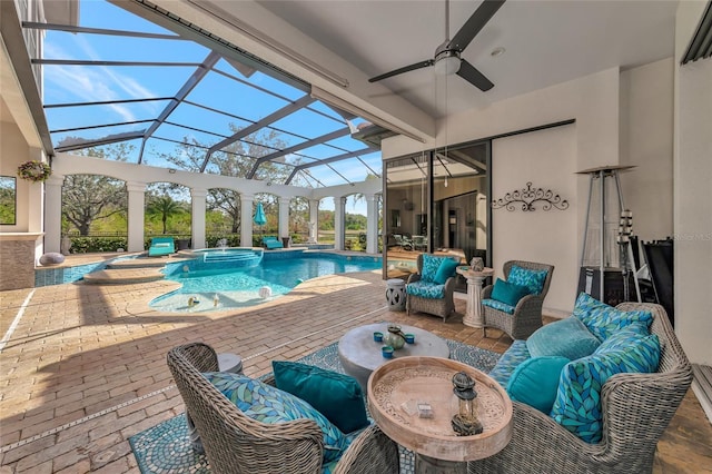 view of swimming pool with outdoor lounge area, ceiling fan, a lanai, an in ground hot tub, and a patio