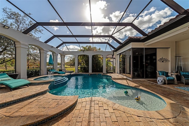 view of swimming pool featuring glass enclosure, an in ground hot tub, and a patio