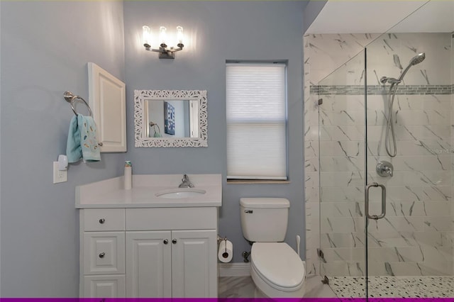 bathroom featuring vanity, an enclosed shower, and toilet