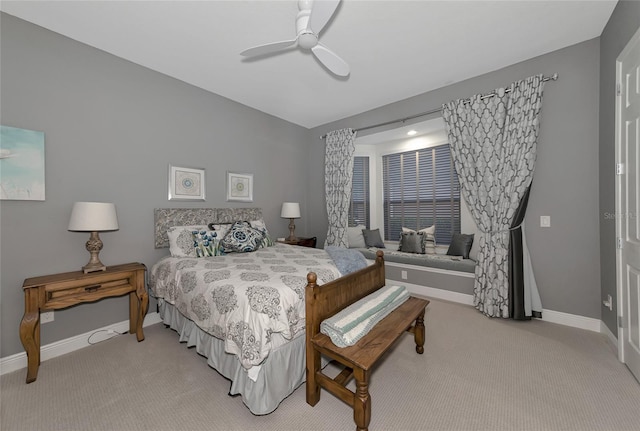 bedroom featuring ceiling fan and light colored carpet