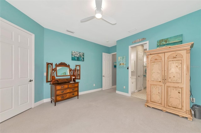 carpeted bedroom with ceiling fan and ensuite bathroom