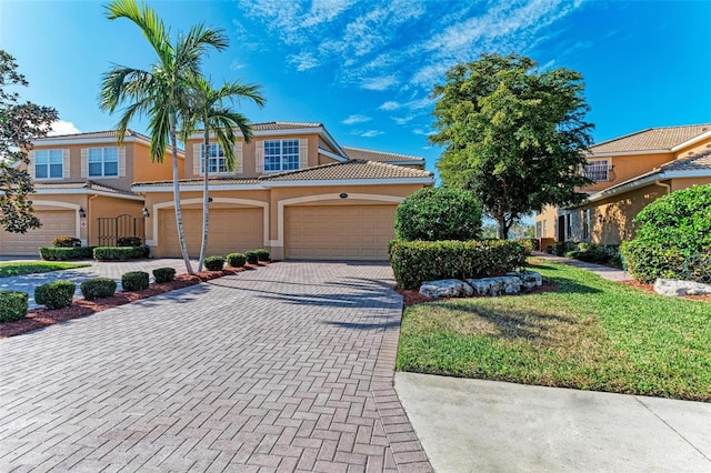 view of front facade featuring a front yard and a garage