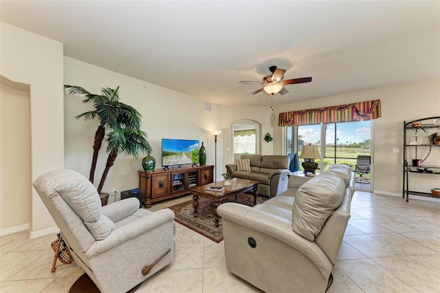 living room with ceiling fan and light tile patterned flooring