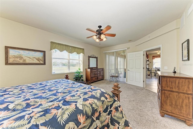 bedroom featuring light colored carpet and ceiling fan