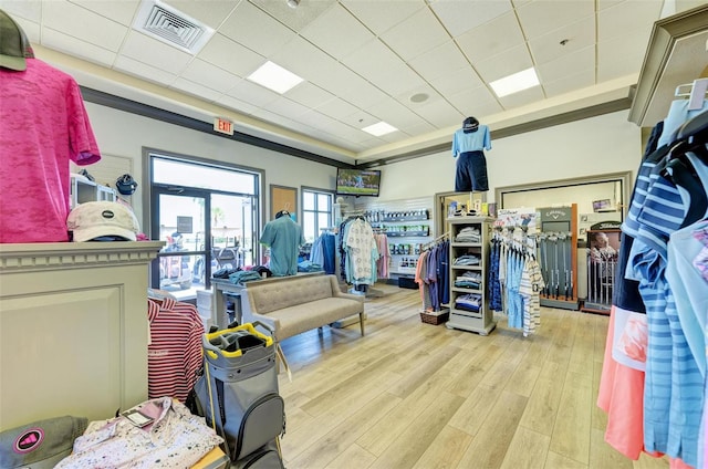 interior space with light hardwood / wood-style flooring and a drop ceiling