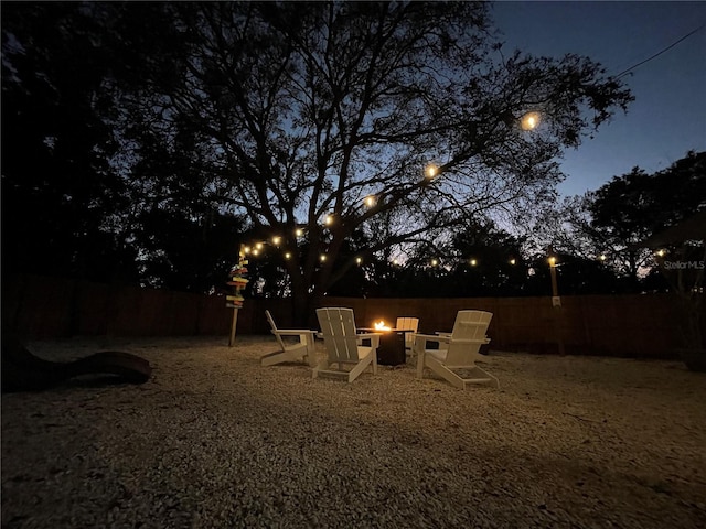 view of yard featuring an outdoor fire pit