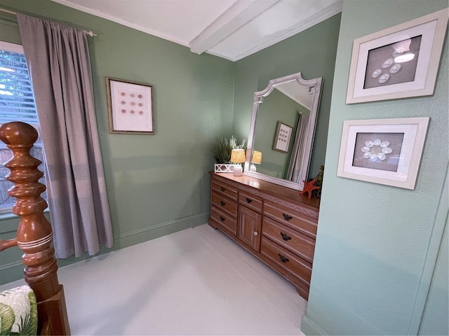 bathroom featuring beam ceiling and vanity