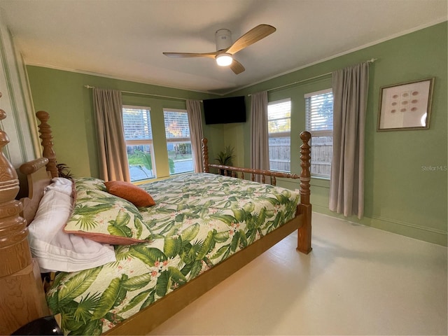 bedroom featuring ceiling fan and crown molding