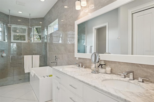 bathroom with vanity, tile patterned floors, and plus walk in shower