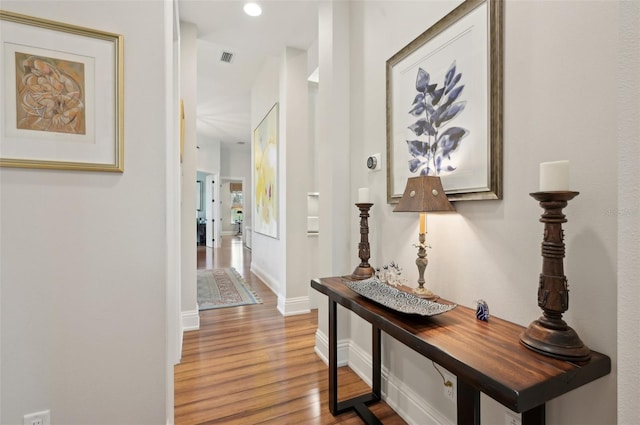 hallway featuring wood-type flooring