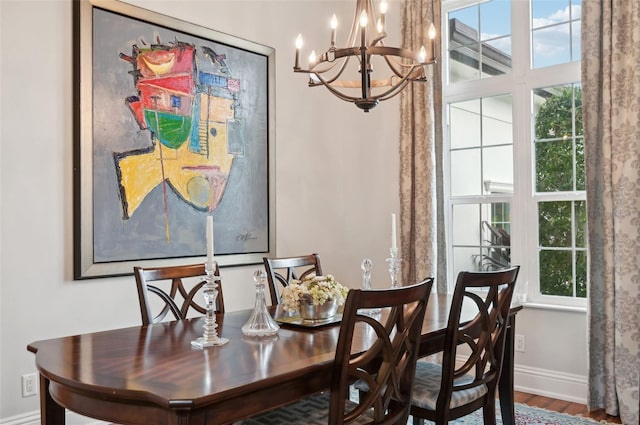 dining room with a chandelier and hardwood / wood-style floors