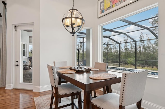 dining space with hardwood / wood-style flooring