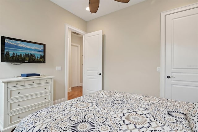 bedroom with ceiling fan and wood-type flooring