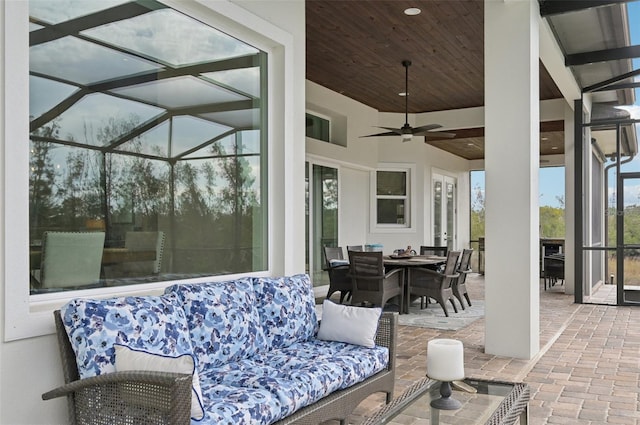 view of patio with a lanai and ceiling fan