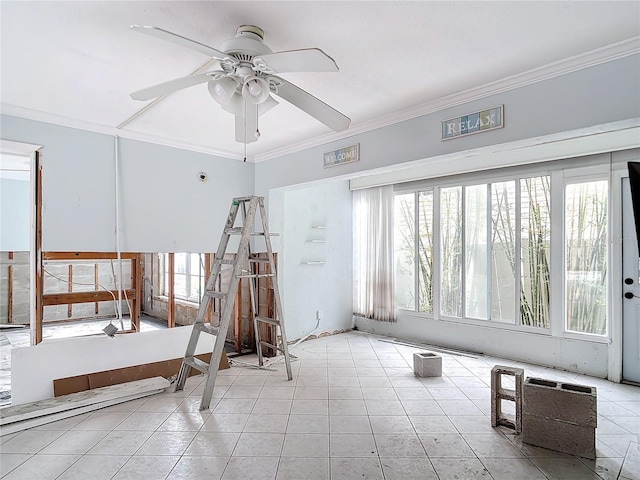 interior space featuring ceiling fan, a healthy amount of sunlight, ornamental molding, and light tile patterned floors