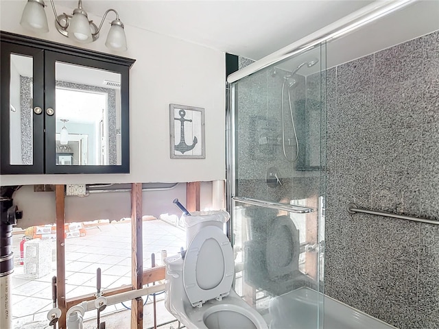 bathroom with toilet and walk in shower