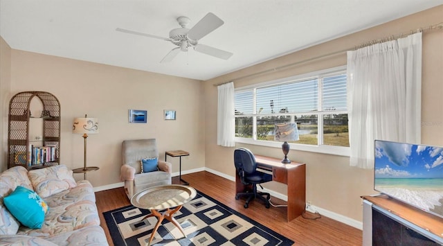 office with hardwood / wood-style floors and ceiling fan