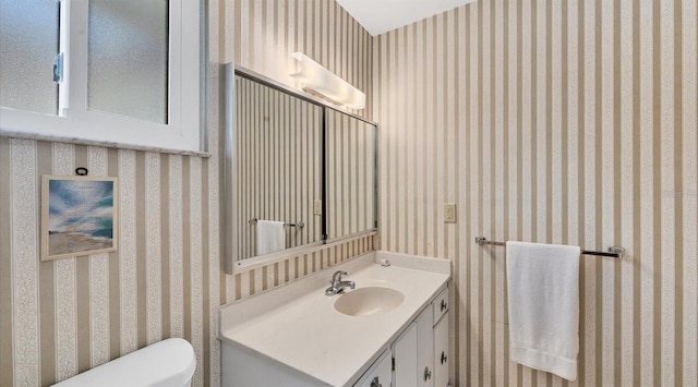 bathroom with vanity and toilet