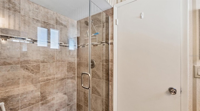 bathroom featuring an enclosed shower