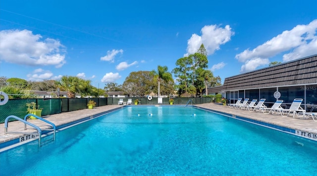 view of swimming pool with a patio area