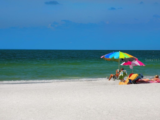 property view of water featuring a beach view